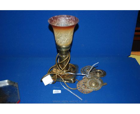 A Brass electric light with orange edged glass shade together with seven Horse Brasses