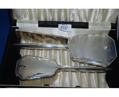 A cased Silver Hairbrush, Hand Mirror and Comb set