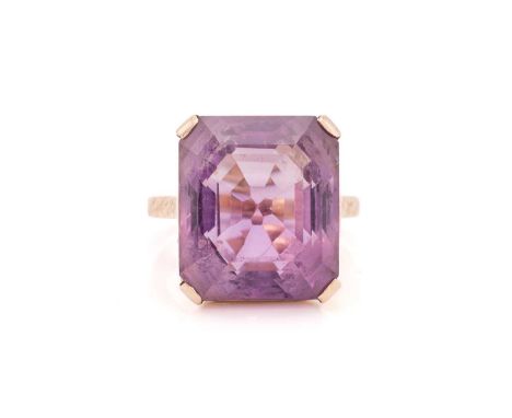 An amethyst dress ring, comprising an octagonal-cut amethyst approximately measuring 17.1 x 14.9 x 12.0 mm, claw-set in a mou