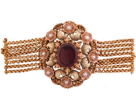 A garnet and pearl cannetille bracelet, centred with an oval table-cut almandine garnet, mounted in a bi-coloured scrolled su