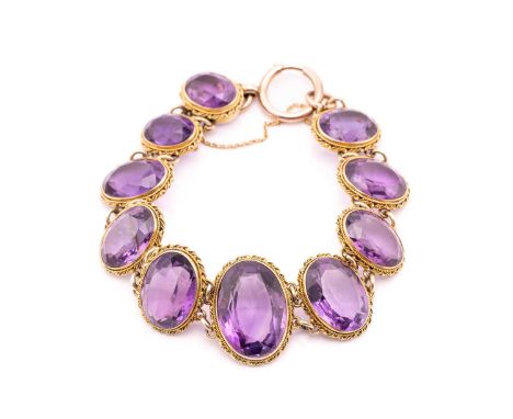 An amethyst bracelet, composed of ten graduated oval-cut amethysts in vivid purple colour, mounted in open back collets edged
