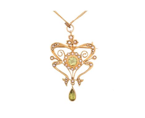 An Edwardian peridot and pearl brooch pendant on chain, centred with a circular-set peridot frame by a seed pearl border, in 