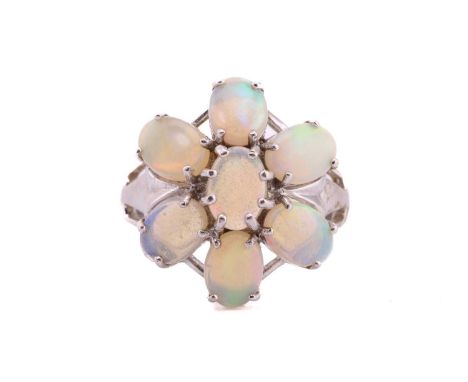 A 9ct white gold and opal floral cluster ring, set with seven oval cabochon opals, the opals measuring approximately 7 x 5 mm