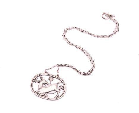 Georg Jensen - A necklace with kneeling fawn and flowers, attached to a cable chain and toggle clasp, designed by Arno Malino