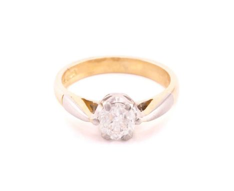 A diamond solitaire ring in 18ct bi-coloured gold, containing a circular-cut diamond of 4.6 mm, in a coronet setting, to tape