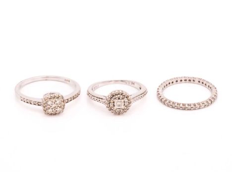 Three diamond set rings, comprising of a pave set round brilliant cut diamond 'tiered' ring in white metal stamped 9k, ring s