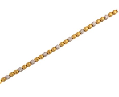 A two-toned line bracelet set with diamonds, each link with a grooved decorated edge and alternating colours, with fifteen di