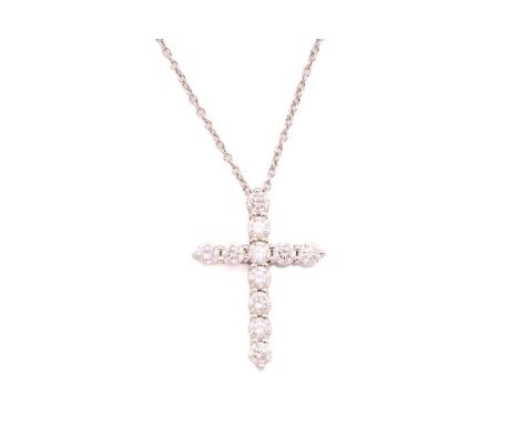 Tiffany & Co. - a diamond cross pendant on chain, encrusted with eleven brilliant-cut diamonds in cruciform, suspending on a 
