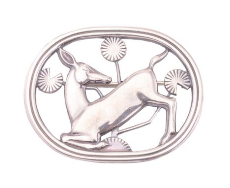 Georg Jensen - A brooch depicting kneeling fawn and flowers, fitted with hinged pin stem and roll-over safety catch, designed