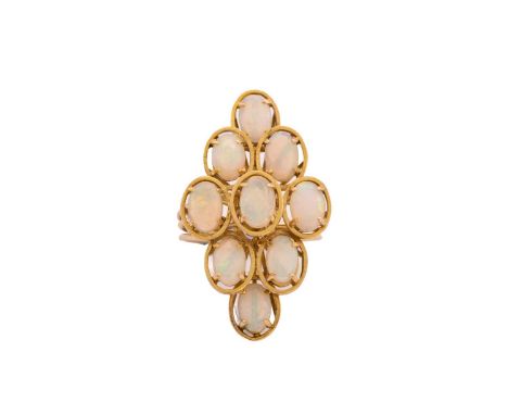 A tiered cluster opal ring, comprising nine oval precious opal cabochons, each in claw settings with satin finish surround, s