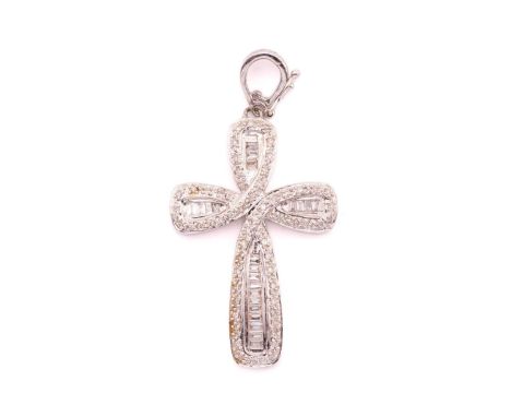 A Diamond set cross, featuring illusion set baguette cut diamonds with claw set 8-cut diamonds in a tapering cross shape meas