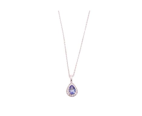 A tanzanite and diamond cluster pendant on chain, featuring a pear-shaped tanzanite of 8.3 x 5.6 mm, strongly dichroic with i