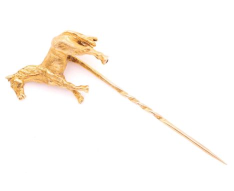 Georg Jensen - a novelty horse stick pin in 9ct yellow gold, consisting of a realistically carved horse, setting upon a slim 