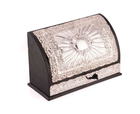 A modern silver mounted leather stationery box, the hinged domed cover with rectangular repousse silver panel incorporating a