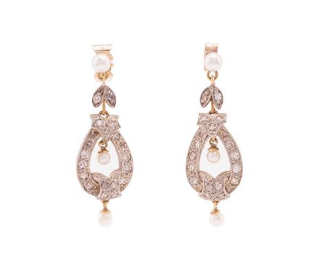 A pair of Belle Époque style pearl and diamond pendeloque drop earrings, each has an articulated foliate surmount and teardro