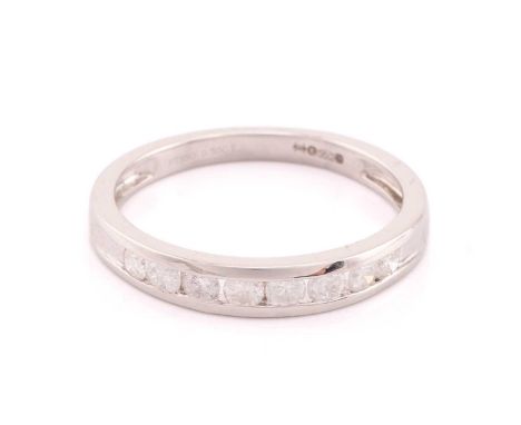 A platinum and diamond half hoop eternity ring channel set with eight round brilliant cut diamonds total diamond weight estim