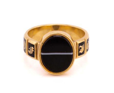 A Victorian mourning ring, set with an oval onyx panel to the centre in collet setting, to a wide ring band with the message 