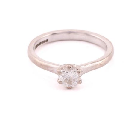 A single stone 18 carat white gold and diamond ring, the round brilliant cut diamond six claw set approximately 4.57mm diamet