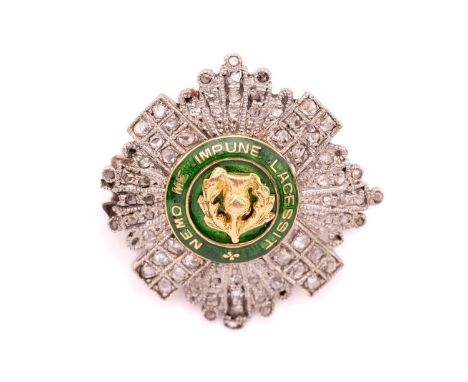 A diamond-set Star of the Order of the Thistle regimental brooch, composed of an applied thistle motif on a circular plaque, 