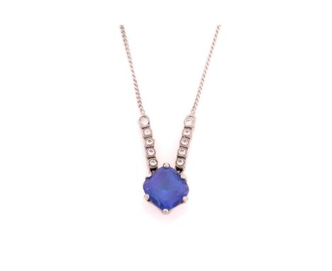 An 18ct white gold Tanzanite and Diamond necklace, formed from a cushion shape Tanzanite measuring 8.85 x 8.5mm claw set into
