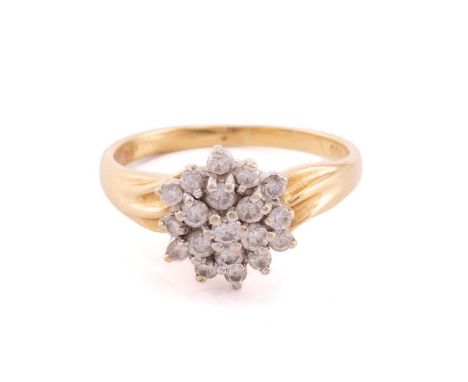 A diamond cluster ring, scintillating with a tiered cluster set with diamonds of 2.2 mm, total diamond weight estimated to be