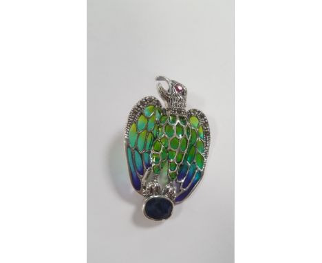 A SILVER EAGLE BROOCH / PENDANT SET WITH A SAPPHIRE, RUBY EYE, COLOURED ENAMEL AND MARCASITES