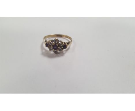 A LADIES 9 CT GOLD DRESS RING SET WITH CZS AND PURPLE STONES