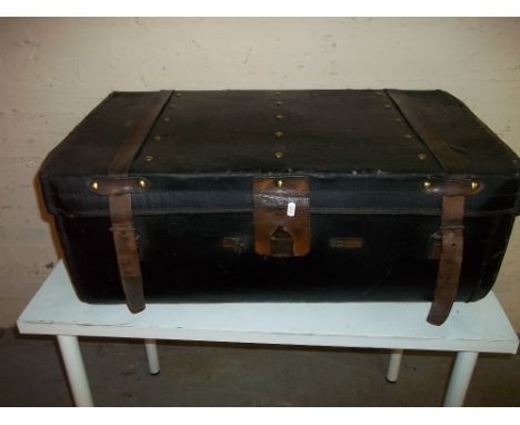 A LEATHER BOUND STORAGE / TRAVEL TRUNK BY R. CLAMP &amp; SON