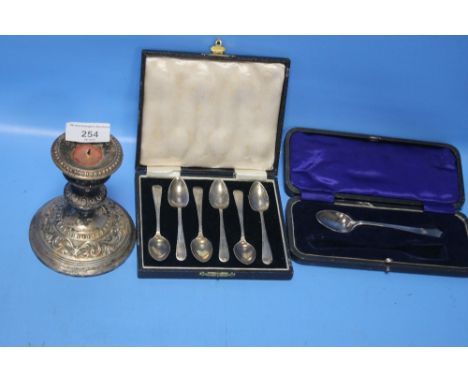 A QUANTITY OF SILVER ITEMS TO INCLUDE A CANDLESTICK, SPOONS, SUGAR TONGS ETC.