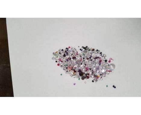 A BAG OF LOOSE, MIXED STONES INCLUDING CUBIC ZIRCONIA, SAPPHIRE, RUBY EMERALD, GARNETAND AMETHYST, 94.07 CT