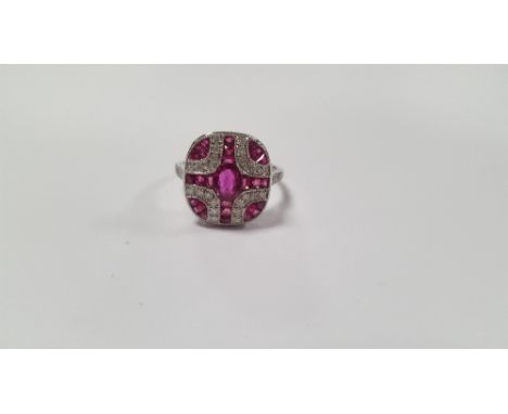 A PLATINUM ART DECO-STYLE PANEL RING SET WITH OVAL-CUT AND CALIBRE-CUT RUBIES AND RBC DIAMONDS, RUBIES APPROX. 1.15 CT , DIAM