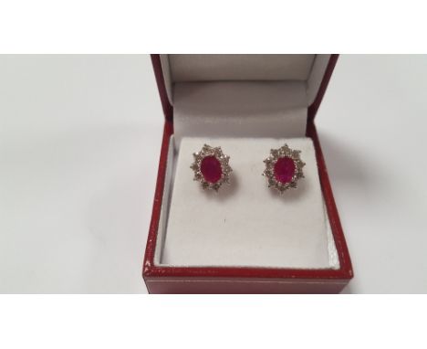 A PAIR OF 18 CT WHITE GOLD RUBY AND DIAMOND CLUSTER STUDS, RUBIES APPROX. 1.9 CT, DIAMONDS APPROX. 1 CT, BOXED