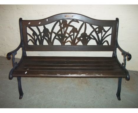 A CAST IRON GARDEN BENCH