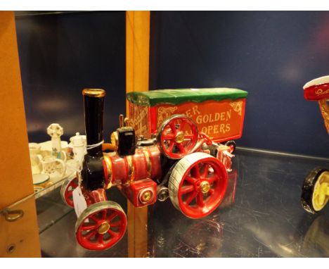 A late 20thC handmade ceramic model of a traction engine together with a matching showman's caravan and steam crane