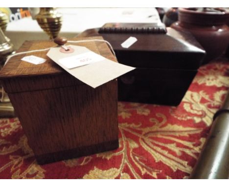 A George III rosewood sarcophagus shaped two section tea caddy with gadrooned top together with an oak cross-banded tea caddy