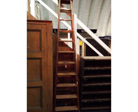 A vintage eleven rung wooden step ladder by Drew Clark & Co Ltd, Leyton, London