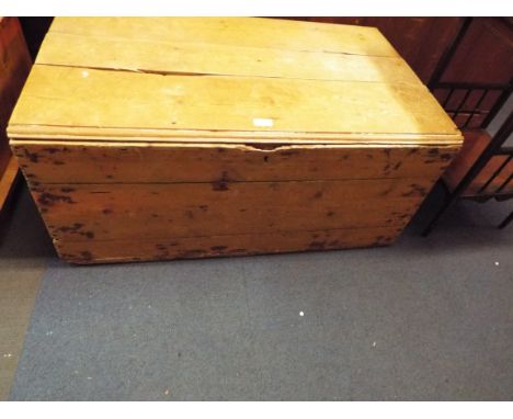 A vintage low pine trunk with iron fittings