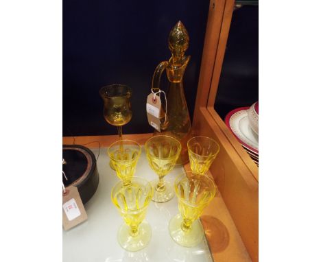 A set of four Victorian facet cut uranium yellow glass glasses, two others and a decanter