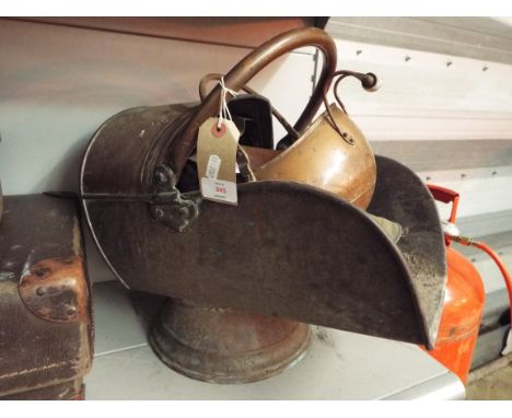 A Victorian copper helmet shaped coal scuttle together with another smaller scuttle