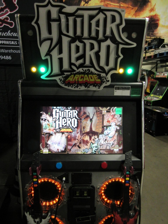 GUITAR HERO ARCADE RAW THRILLS MUSIC GAME Item is in used condition