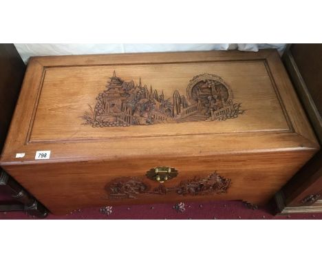 A carved camphor wood trunk