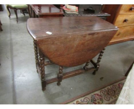 An oak barley twist gate leg table.
