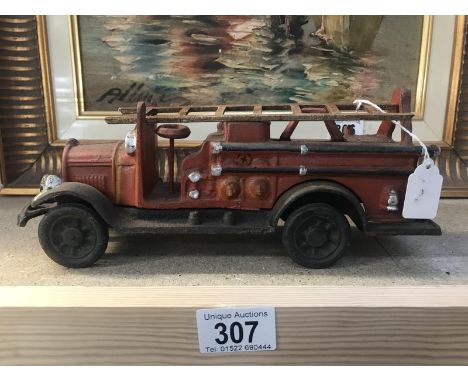 A cast iron reproduction fire engine.