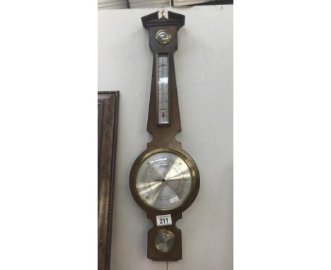 A modern aneroid barometer by Comitti of London