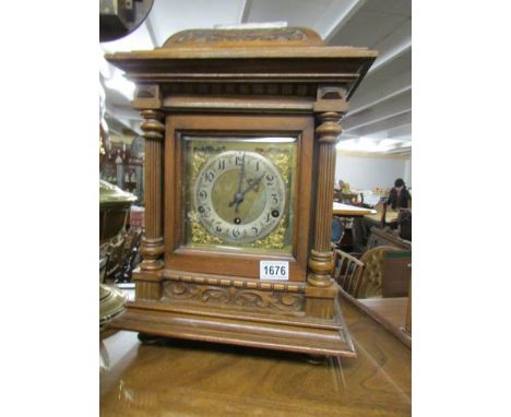 An oak bracket clock.