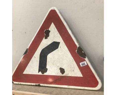 A vintage enamel warning triangle road sign 'bend in road'