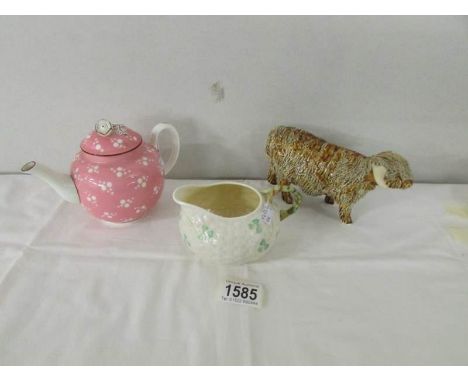 A Royal Worcester teapot marked 1874, a Belleek milk jug and a Scottish pottery spaghetti style highland bull, signed.