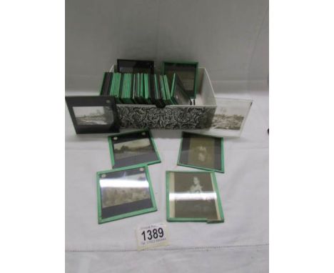 Approximately 50 magic lantern slides on landscape and portrait art work.