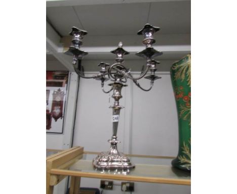 A 4 branch Sheffield plate candelabra with snuffer.