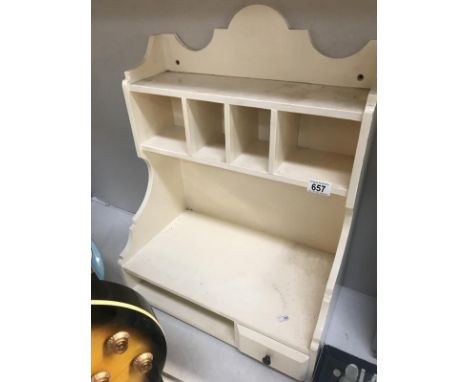 A white painted kitchen shelf